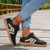 zwarte retro sneakers met beige strepen en rubberen zool