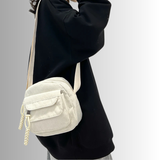 Urban Cord Mini crossbody tas in creme corduroy, compact design met meerdere kleurenopties.