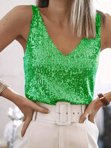 groene paillettentop zonder mouwen met witte broek