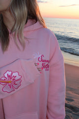 Solbelle hoodie gedragen tijdens zonsondergang aan zee