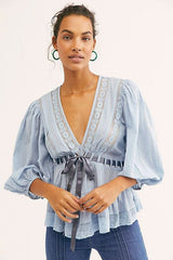 blauwe blouse met kant en pofmouwen en taille strik dames