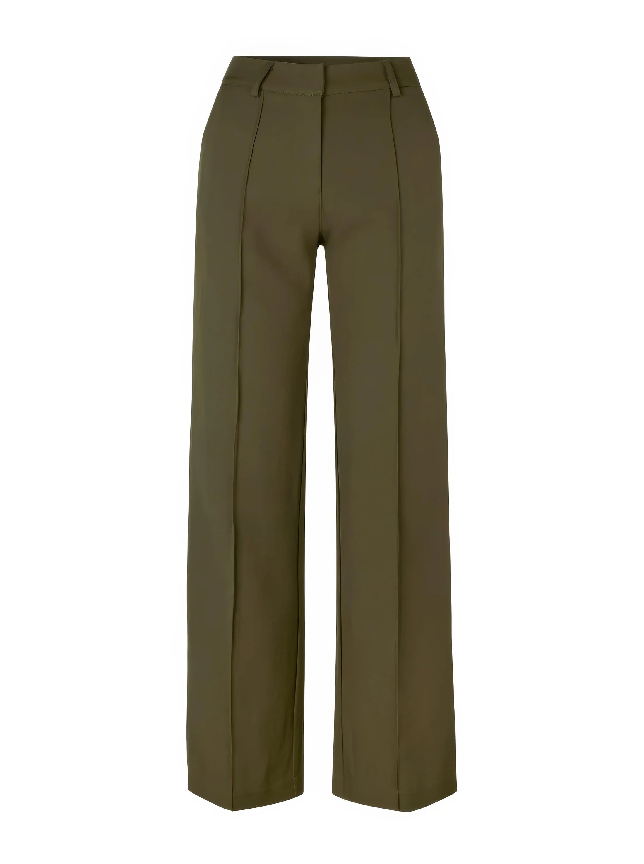 close-up van groene pantalon met sneakers en hoge taille