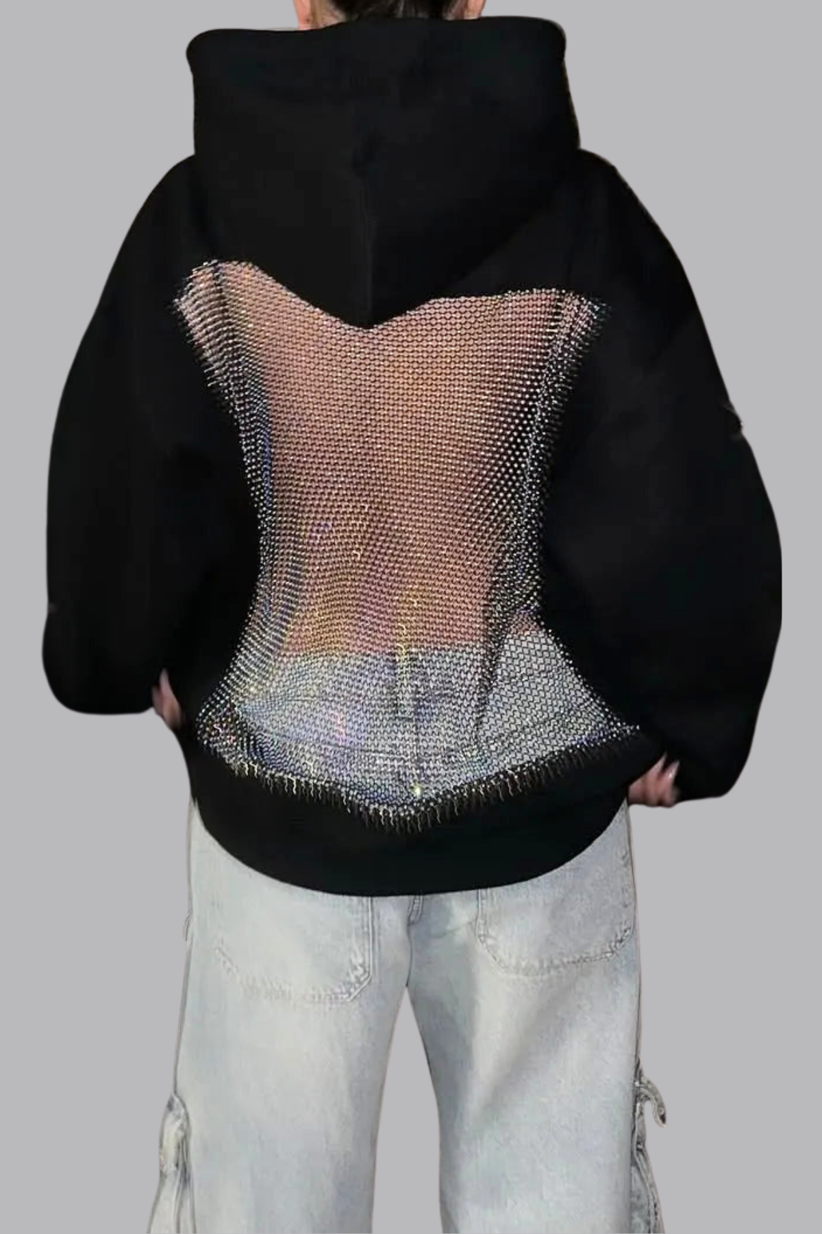 Zwarte glitter mesh hoodie met transparant rugpaneel en straight leg jeans