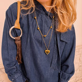 Valentina Heart ketting gedragen over denim blouse