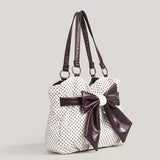 witte schoudertas met zwarte stippen en grote bruine strik dames
