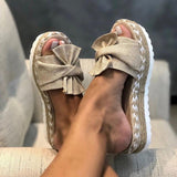 Beige slippers met strik en plateauzool – stijlvolle espadrille sandalen