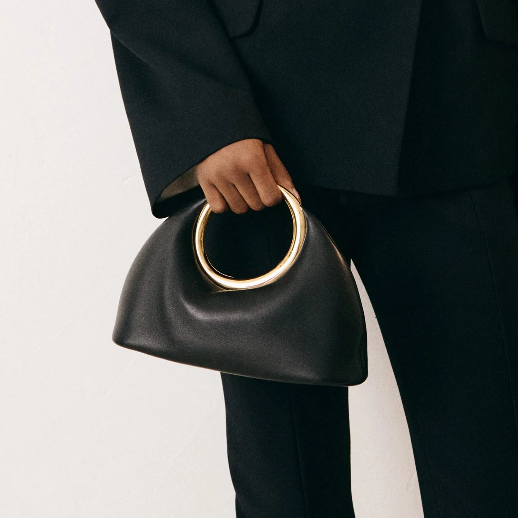 Orella | Sculptural Ring-Handle Handbag in Vegan Leather (Ivory/Black) 