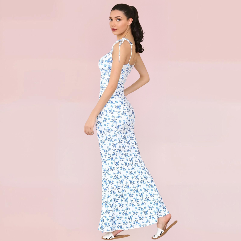 floral swing maxi jurk, lange zomerjurk bloemenprint, elegante damesjurk, flowy maxi jurk, sling maxi jurk, dames jurken trendy 2025, bohemian maxi dress, comfortabele damesjurk, floral swing dress salejano, jurk met flatterende pasvorm
