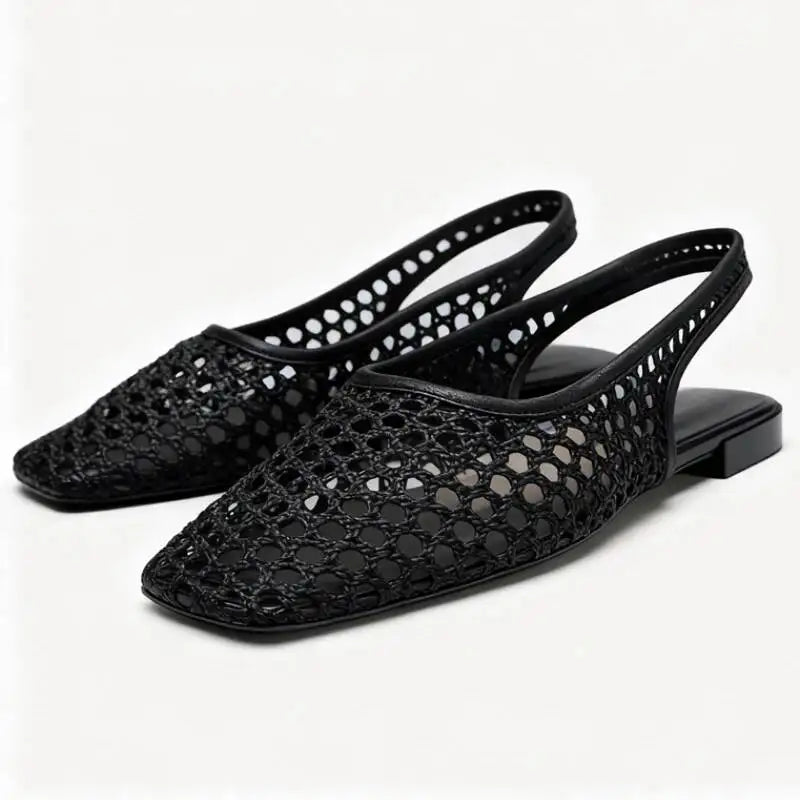 Opengewerkte slingback flats met spitse neus