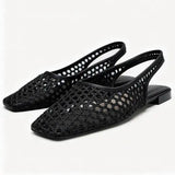 Opengewerkte slingback flats met spitse neus