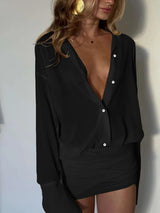 minijurk zomer, zwarte minijurk, blouse look jurk, jurk met rok effect, geplooide jurk, casual chic jurk, dames zomerjurk, jurk in één stuk, elegante zomerjurk, jurk met lange mouwen, brunch outfit, citytrip outfit dames, zwarte jurk casual, pofmouw jurk, jurk met v-hals, jurk met zwierige rok, luchtige jurk dames, vrouwelijke minijurk, zomerjurk zwart, outfit met klasse