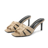 beige leren slippers met hak en strikdetail
