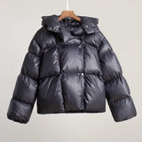 grijze pufferjas met capuchon op hanger
