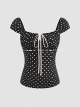 Liora zwarte romantische dames top met witte stippen en vierkante hals