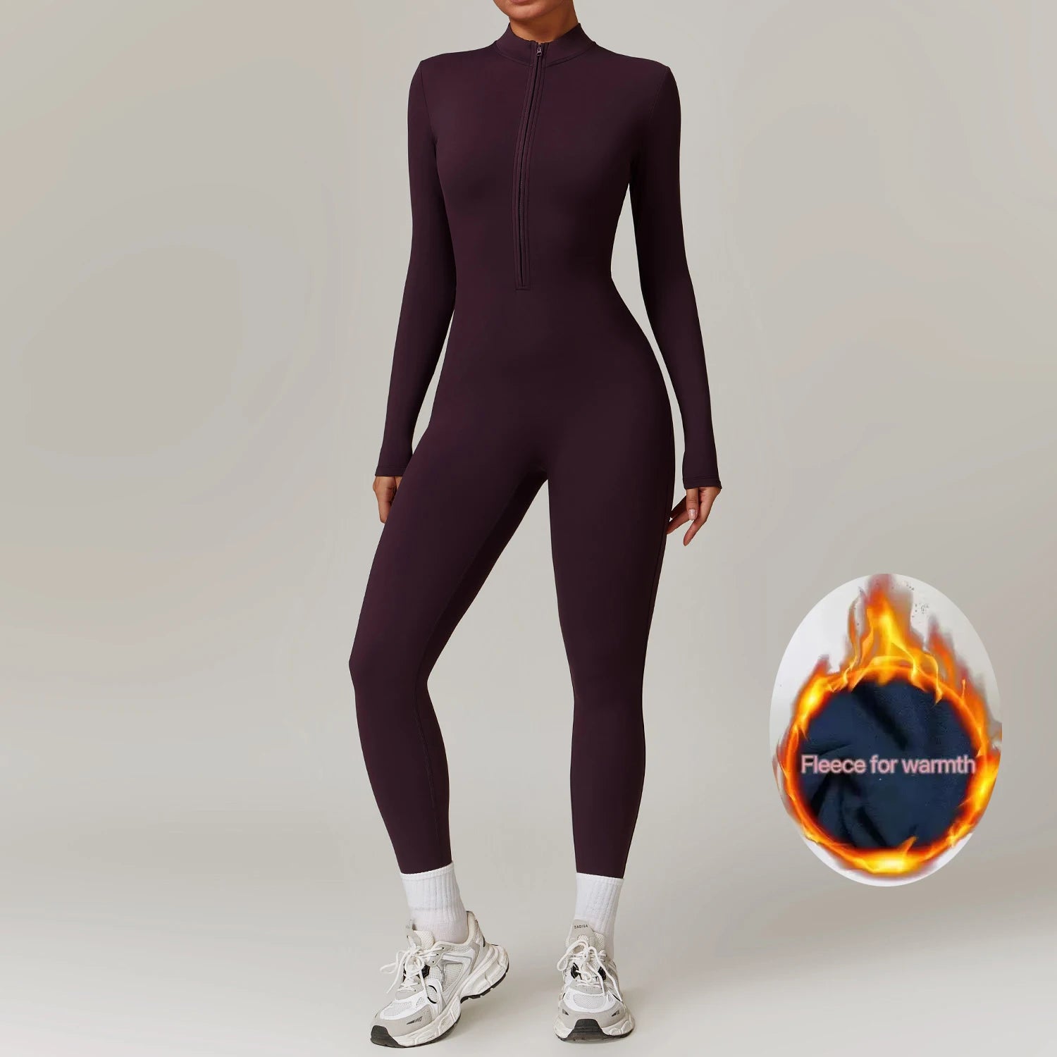 MovePro Winter Jumpsuit voor dames in aubergine, met fleece voering en superstretch stof. Ideaal voor sporten, joggen en casual winterlooks.