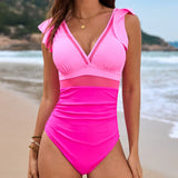 Roze badpak met doorzichtig mesh detail en diepe halslijn