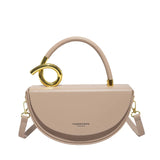 taupe handtas met gouden swirl handvat – luxury dupe bag
