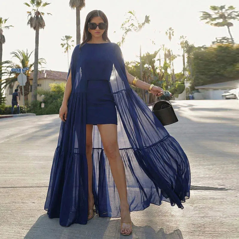 donkerblauwe jurk met cape effect en korte onderjurk dames