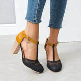 zwarte retro pumps met mosterdgeel accent en t-bandje