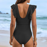 achterkant van zwarte monokini met open rug en hoge uitsnijding