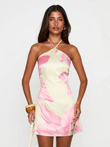 halterjurk dames met grote bloemenprint en elegante halslijn