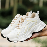 witte sportieve damessneakers met gele accenten en profielzool