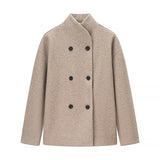 beige oversized double breasted damesjas met zwarte knopen