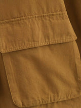 detailfoto grote flapzak op camel workwear jacket