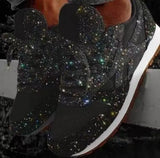 Zwarte glitter sneakers met subtiel galaxy-patroon en witte zool