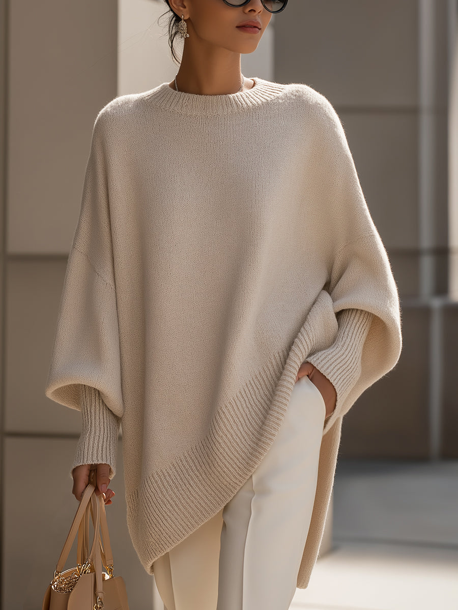 Beige oversized trui met vleermuismouwen en brede ribboorden aan de mouwen