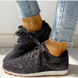 Zwarte glitter sneakers met subtiel galaxy-patroon en witte zool
