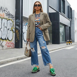 groene instappers met dikke zool en opvallend strikdetail