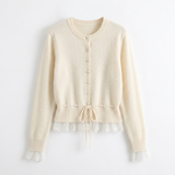 cremekleurige gebreid vest met romantische kantafwerking