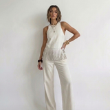 Off-white franjetop van kunstleer met ronde hals in een zomerse look toon op toon