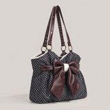 zwarte polkadot schoudertas met bruine strik en kanten detail