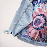Denim jas met strass en artistieke print