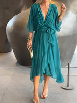 turquoise midi jurk met diepe v-hals en zwierige snit