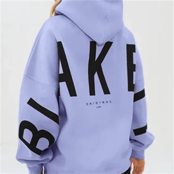 paarse oversized sweat met capuchon en witte tekst op rug